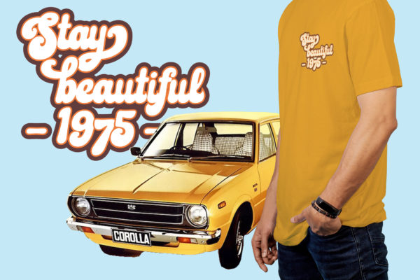 A man wearing a yellow t - shirt next to a yellow car.