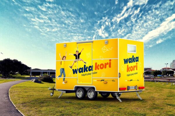 Yellow trailer at at carpark, branded by digital agency Wonderlab