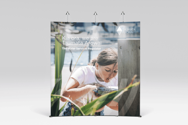 A banner with a woman looking at plants.