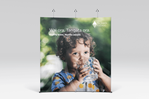 A child is drinking water from a glass.